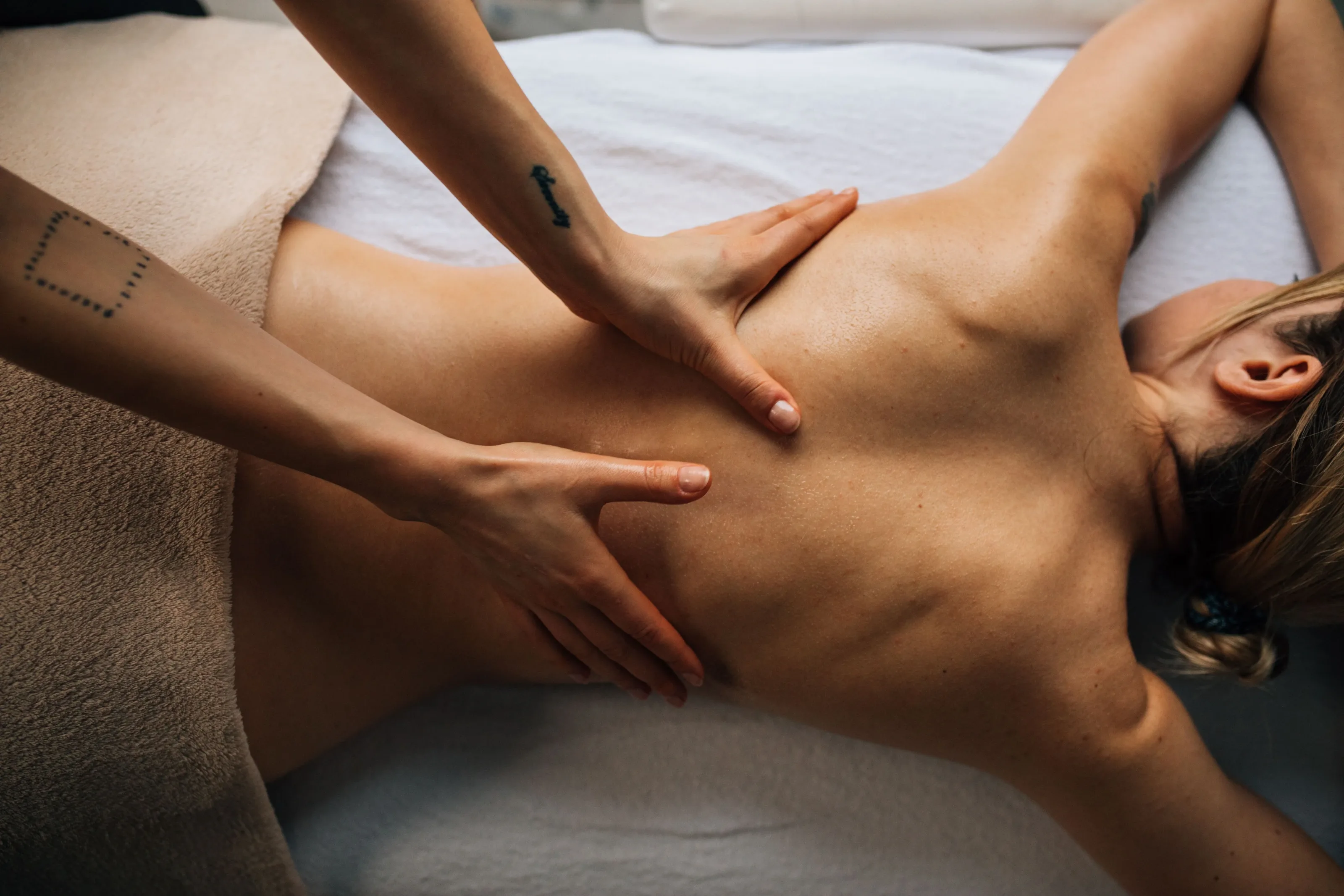 Client lying face down enjoying a back massage